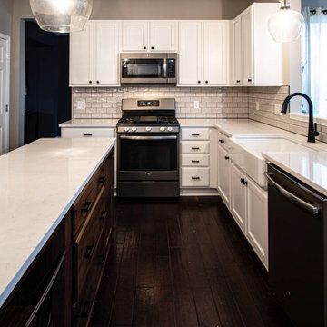 Two Tone Kitchen: White Cabinetry with Custom Knotty Alder Island and Faux Beam