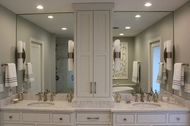 Photo of a mid-sized traditional master bathroom in Other with a freestanding tub, a double shower, white tile, porcelain tile, grey walls, porcelain floors, an undermount sink and engineered quartz benchtops.