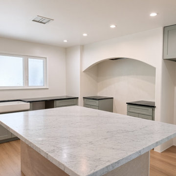 Black Soapstone Perimeter and Carrara Marble Island, Sage Cabinets