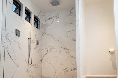 Example of a large minimalist master porcelain tile and double-sink bathroom design in San Diego with a floating vanity