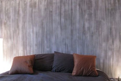 Large trendy master dark wood floor bedroom photo in Other with multicolored walls