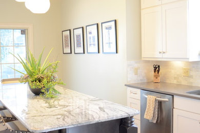 Inspiration for a mid-sized contemporary galley bamboo floor kitchen remodel in New York with an undermount sink, shaker cabinets, white cabinets, quartzite countertops, gray backsplash, stone tile backsplash, stainless steel appliances and an island