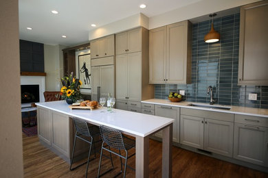 Example of a transitional kitchen design in Denver