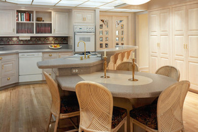 Inspiration for a mid-sized mid-century modern l-shaped light wood floor and beige floor enclosed kitchen remodel in Other with a drop-in sink, recessed-panel cabinets, light wood cabinets, granite countertops, gray backsplash, colored appliances, an island and stone slab backsplash