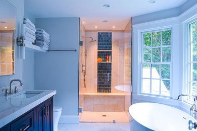 Bathroom - mid-sized traditional master black and white tile and ceramic tile ceramic tile and white floor bathroom idea in Boston with recessed-panel cabinets, blue cabinets, a one-piece toilet, an undermount sink, quartz countertops, a hinged shower door and white countertops