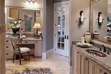 Example of a large master ceramic tile bathroom design in Atlanta with an undermount sink, raised-panel cabinets, light wood cabinets, granite countertops and beige walls