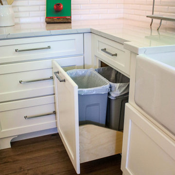 White Kitchen with Gray Quartz Countertops, Farmhouse Sink and Hardwood Floors