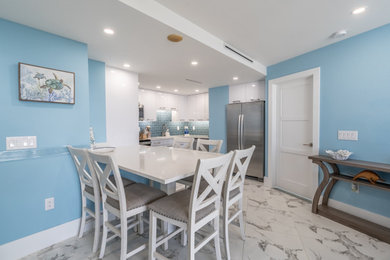 Example of a beach style kitchen/dining room combo design in Miami