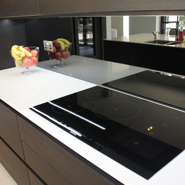 Sleek Handle-less Dark Oak kitchen