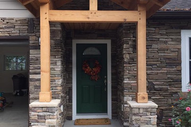 Inspiration for a timeless beige two-story concrete fiberboard exterior home remodel in Other with a shingle roof
