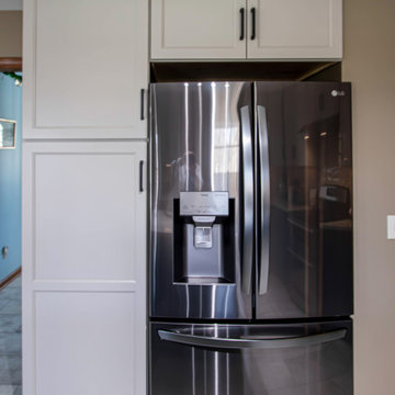 Two Tone Teal and Cream Kitchen with Romano White Quartz Countertop