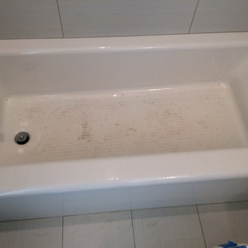 Rust stains on new Kohler castiron tub BEFORE