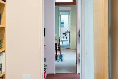 Mid-sized 1960s porcelain tile hallway photo in Boston with multicolored walls