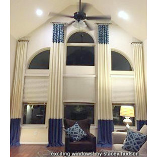 Drapery to Accent Large Arched Window with an Angled Ceiling
