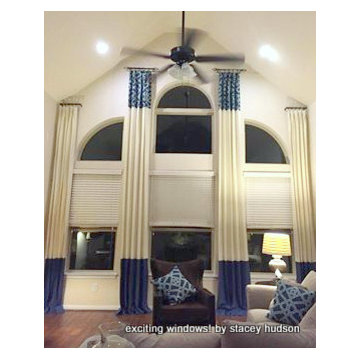Drapery to Accent Large Arched Window with an Angled Ceiling