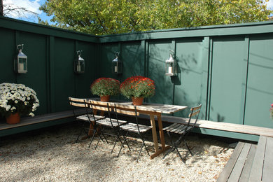 Example of a mid-sized transitional backyard patio design in Boston with no cover