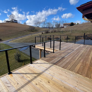 A Mountain Home Deck Elevated with Black Cable Railing
