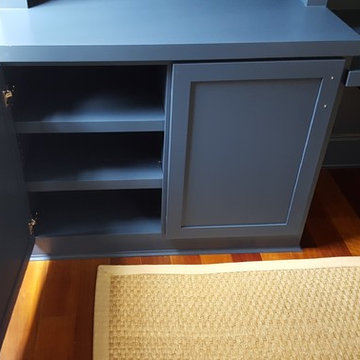 Dark Blue Office Built-in With Center Desk and Pullouts