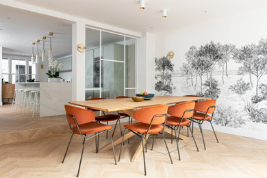 This is an example of a large contemporary open plan dining room in London with white walls, ceramic flooring, no fireplace, beige floors, all types of ceiling, wallpapered walls and a feature wall.