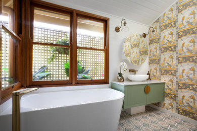 Design ideas for a mid-sized traditional bathroom in Brisbane with shaker cabinets, green cabinets, a corner tub, an open shower, multi-coloured tile, subway tile, multi-coloured walls, porcelain floors, a vessel sink, engineered quartz benchtops, multi-coloured floor, an open shower, white benchtops, a shower seat, a single vanity, a floating vanity, timber and wood walls.