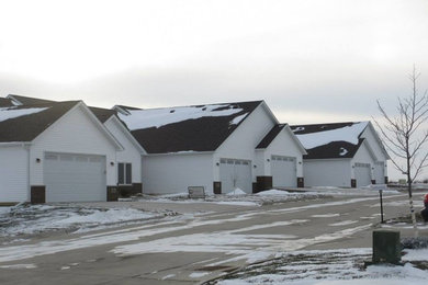 Inspiration for a mid-sized white one-story mixed siding exterior home remodel in Other