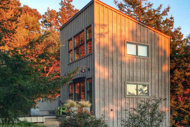 Inspiration for a small modern gray two-story wood exterior home remodel in San Francisco with a shed roof