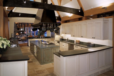 Large transitional u-shaped travertine floor open concept kitchen photo in Denver with a double-bowl sink, recessed-panel cabinets, white cabinets, solid surface countertops, stainless steel appliances and an island