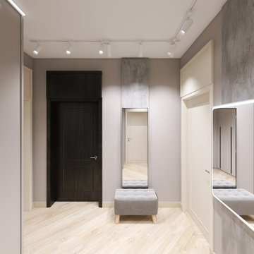 Compact Apartment Entryway with Built-In Storage and Illuminated Mirror