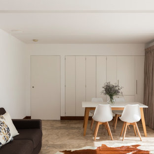 Design ideas for a large retro look-out basement in Sydney with white walls, travertine flooring and brown floors.