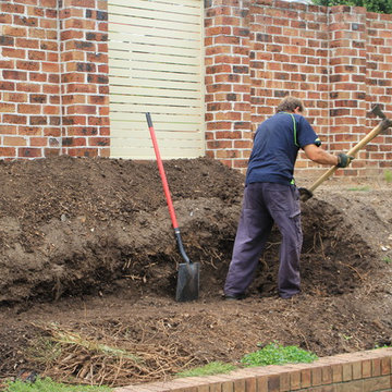 Retaining wall with garden beds