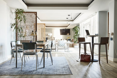 Family room library - mid-sized mid-century modern enclosed beige floor family room library idea in Los Angeles with no fireplace