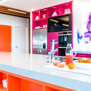 Inspiration for a large contemporary galley kitchen pantry in Napier-Hastings with an undermount sink, orange cabinets, quartzite benchtops, multi-coloured splashback, glass sheet splashback, stainless steel appliances, ceramic floors, with island, white floor and grey benchtop.