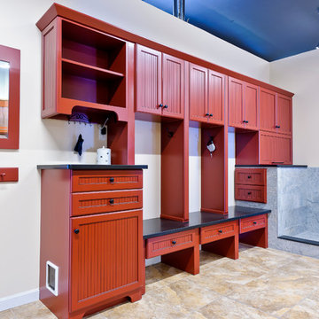 Red painted mudroom with granite benches
