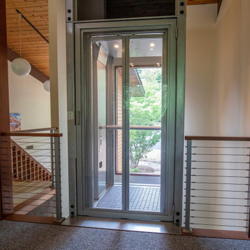 Boxborough Deck House with Modern Home Elevator