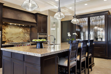 Mid-sized island style u-shaped marble floor eat-in kitchen photo in Phoenix with an integrated sink, recessed-panel cabinets, dark wood cabinets, granite countertops, multicolored backsplash, stainless steel appliances and an island