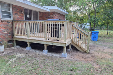 Example of an arts and crafts deck design in Raleigh