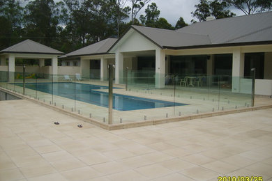 Design ideas for a large modern one-storey concrete beige exterior in Sydney.