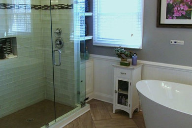 Inspiration for a large contemporary master black and white tile and subway tile porcelain tile freestanding bathtub remodel in Dallas with beaded inset cabinets, gray walls and granite countertops