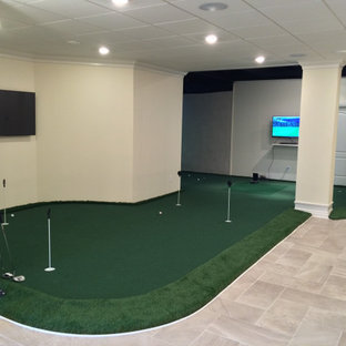 Photo of an expansive classic walk-out basement in Chicago with beige walls, porcelain flooring, no fireplace and grey floors.