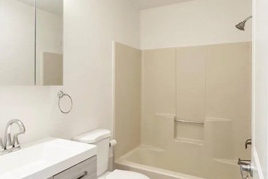 Inspiration for a small modern 3/4 single-sink bathroom remodel in New York with white cabinets and a freestanding vanity