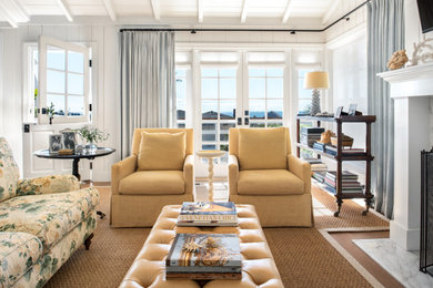 Inspiration for a coastal medium tone wood floor, brown floor, exposed beam, shiplap ceiling, vaulted ceiling and shiplap wall living room remodel in San Francisco with white walls and a standard fireplace