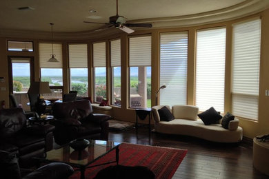 Example of a transitional dark wood floor family room design in Other with beige walls, no fireplace and no tv