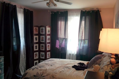 Foto de dormitorio principal moderno pequeño con paredes rosas y moqueta