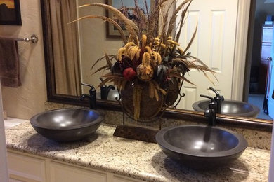 Inspiration for a timeless ceramic tile bathroom remodel in Houston with a vessel sink, shaker cabinets, white cabinets, quartz countertops and beige walls