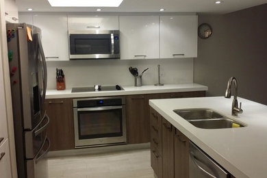 Inspiration for a mid-sized contemporary l-shaped porcelain tile eat-in kitchen remodel in Austin with an undermount sink, quartzite countertops, white backsplash, stainless steel appliances and no island