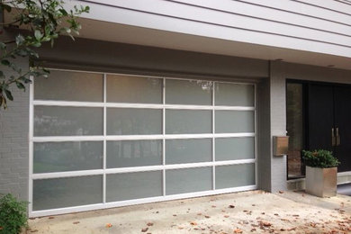 Inspiration for a mid-sized modern attached two-car garage remodel in DC Metro