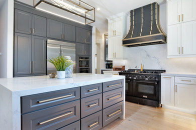 Design ideas for a contemporary kitchen with shaker cabinets and with island.