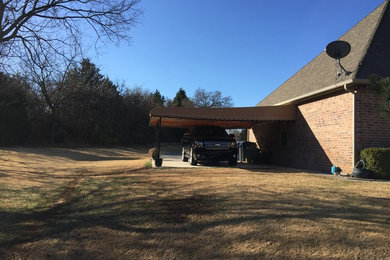Mid-sized mountain style detached two-car garage photo in Oklahoma City