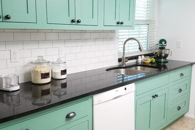 Inspiration for a small transitional galley porcelain tile and beige floor eat-in kitchen remodel in Salt Lake City with a double-bowl sink, shaker cabinets, green cabinets, granite countertops, green backsplash, subway tile backsplash, white appliances and no island