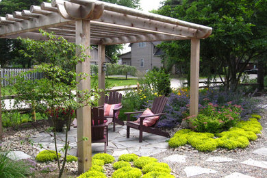 Design ideas for a traditional garden for summer in Toronto with natural stone pavers.